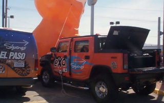 Vehicle graphics on orange truck